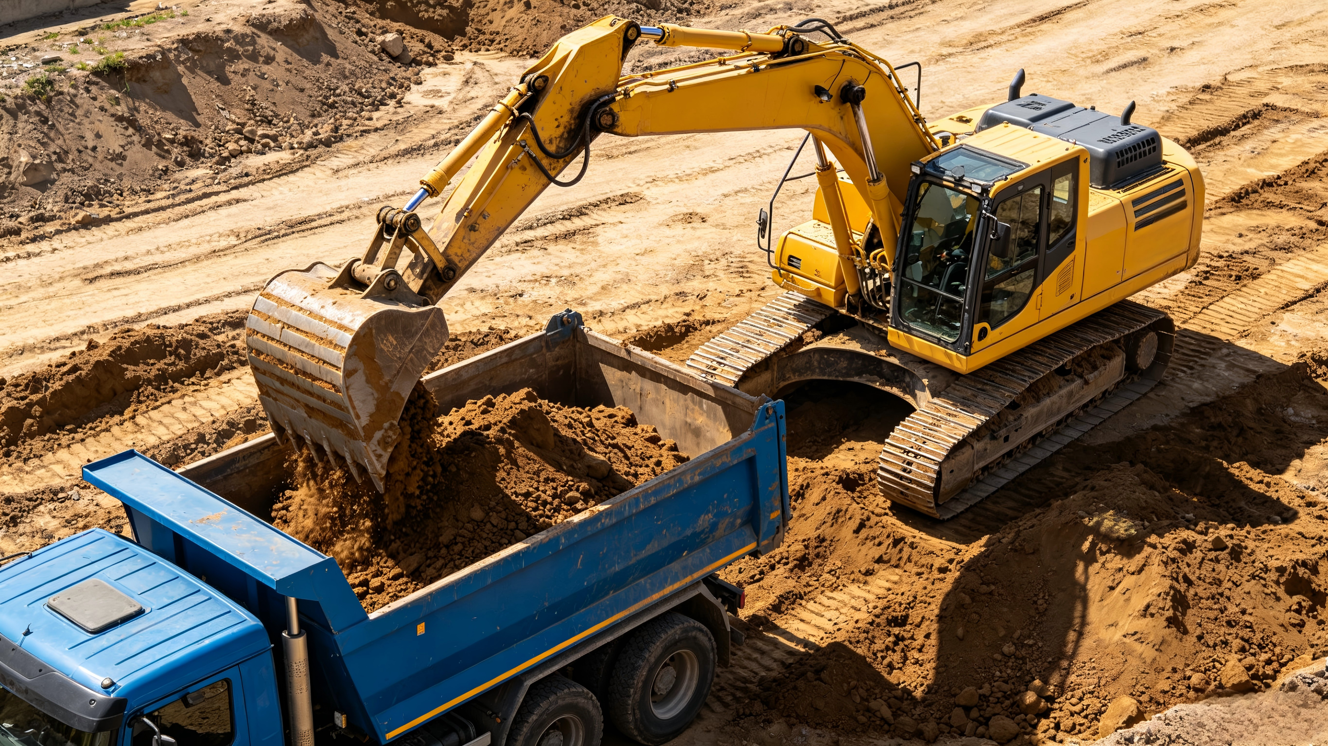 Excavator loading soil into a truck