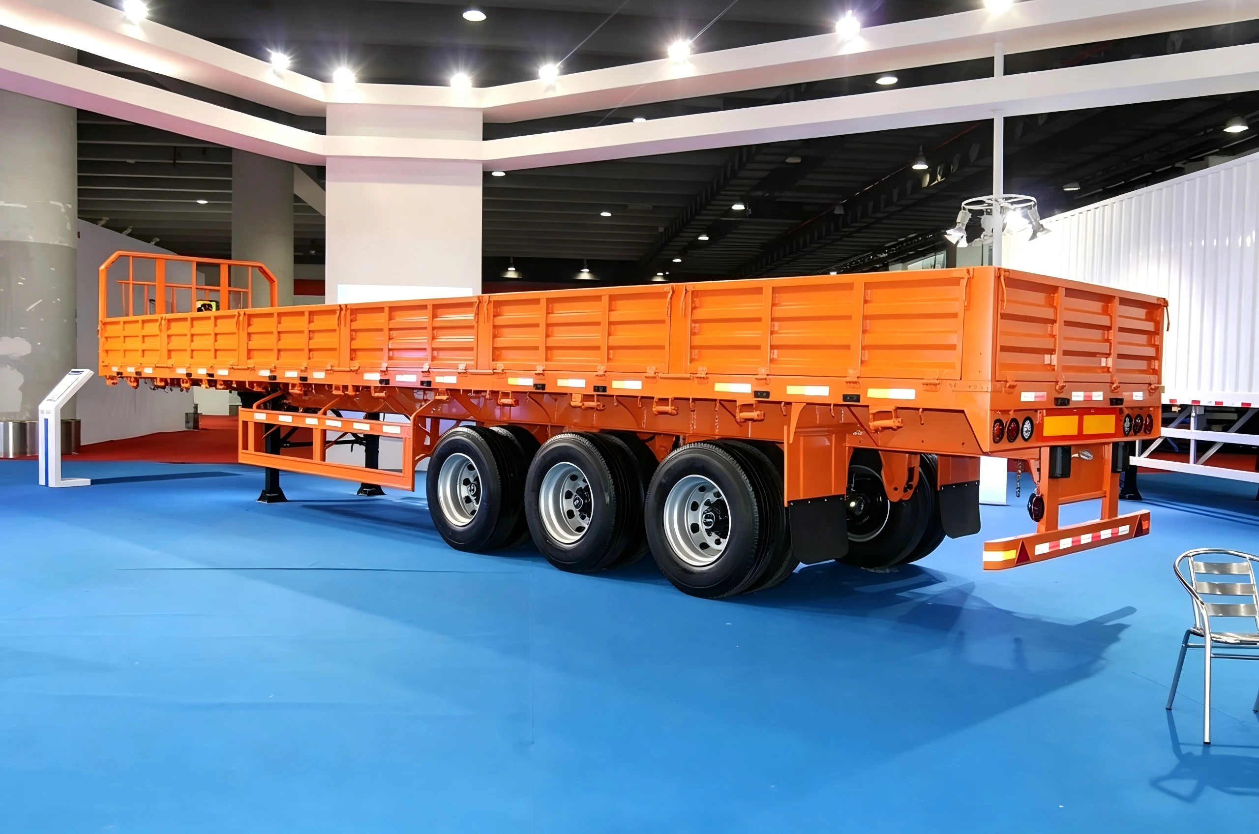 Orange truck trailer in an exhibition hall